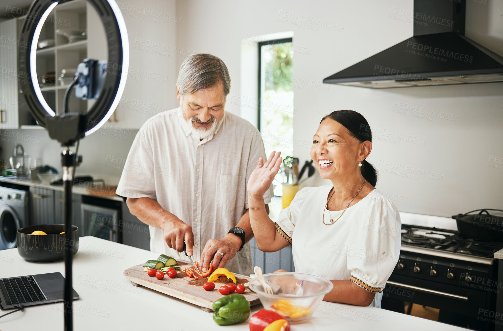 Buy stock photo Home, old couple or influencer with food, live streaming or connection with ring light, cooking instructions or tech. Vlog, elderly man or senior woman with social media, diet plan or content creator