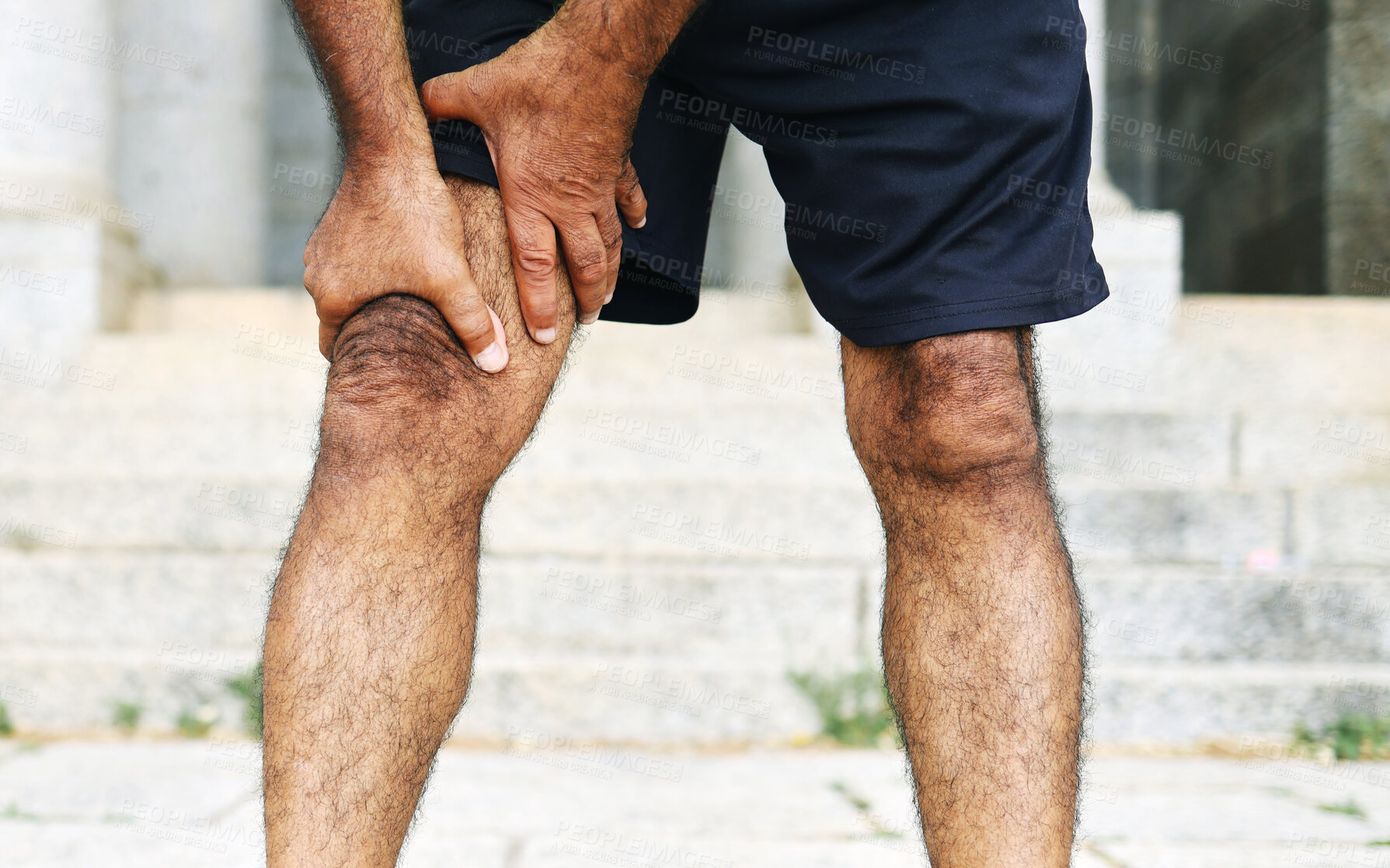 Buy stock photo Man, hands and legs with injury, pain or ache in sports accident, emergency or outdoor exercise. Closeup of male person with sore knee, muscle or tension from workout, fitness or training mistake