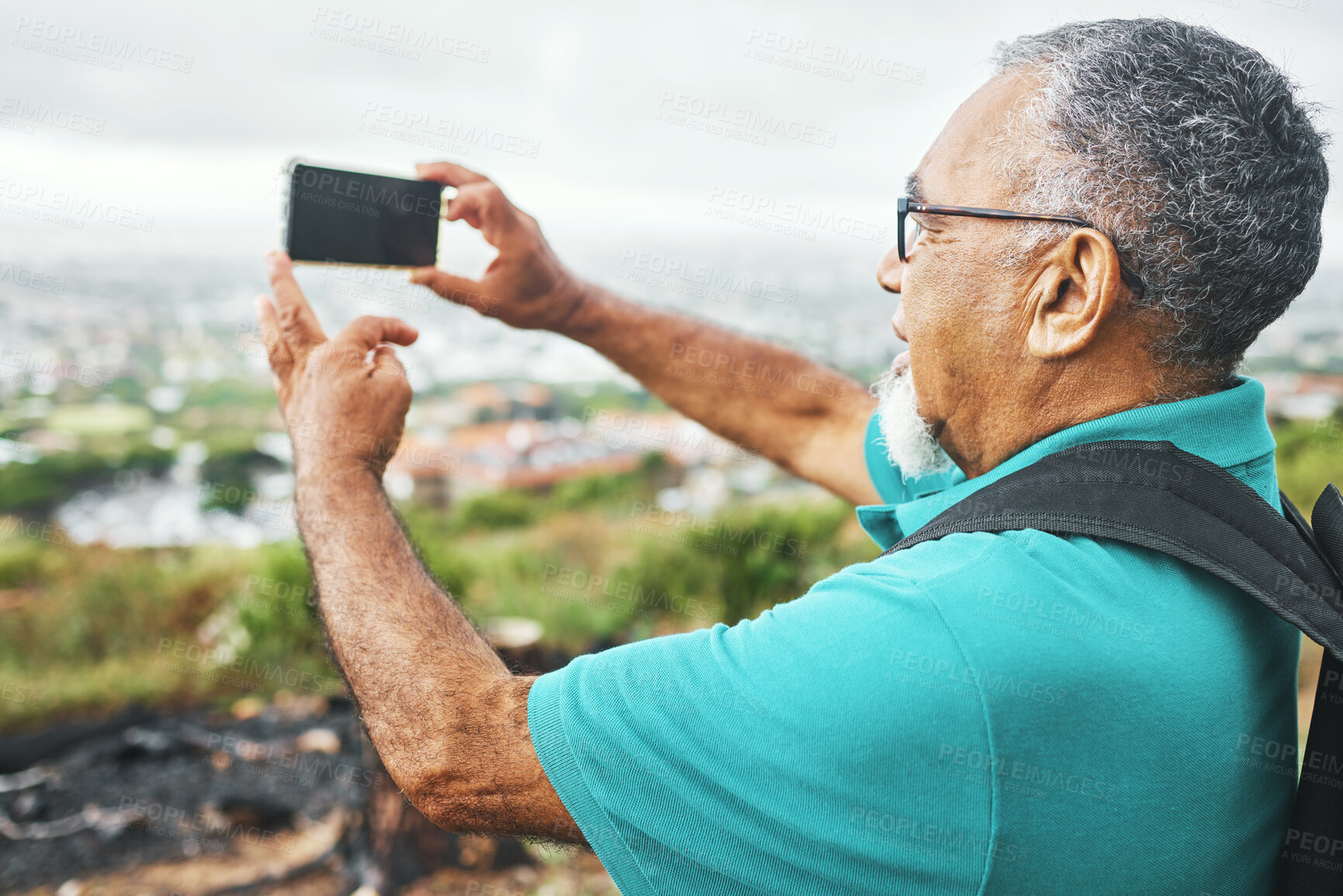 Buy stock photo Phone, photograph or senior man in nature for trekking journey memory or adventure for freedom. Pictures, holiday vacation view or mature male hiker on mountain for exercise, fitness or hiking