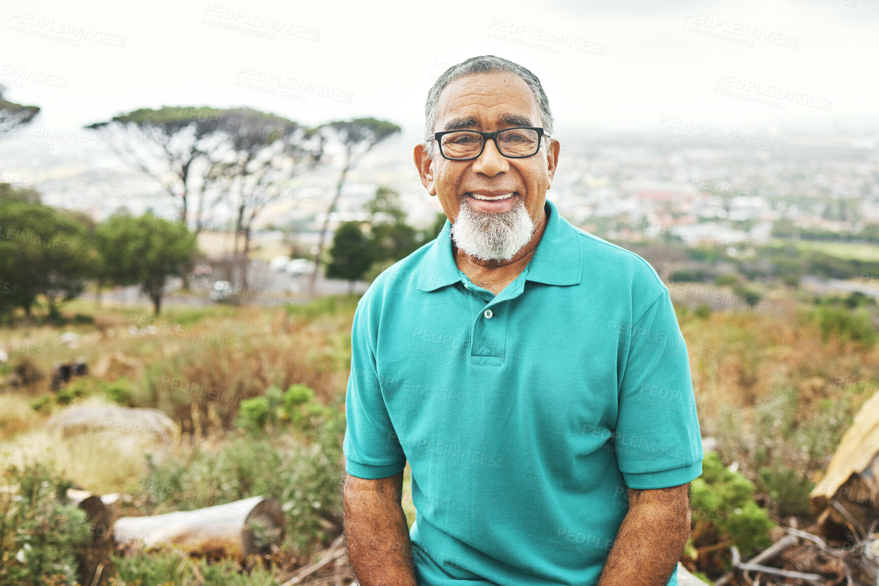 Buy stock photo Senior man, smile and portrait in woods, hiking or walk in nature for health, adventure or holiday in summer. Mature person, happy and outdoor on vacation, wellness and relax in countryside field