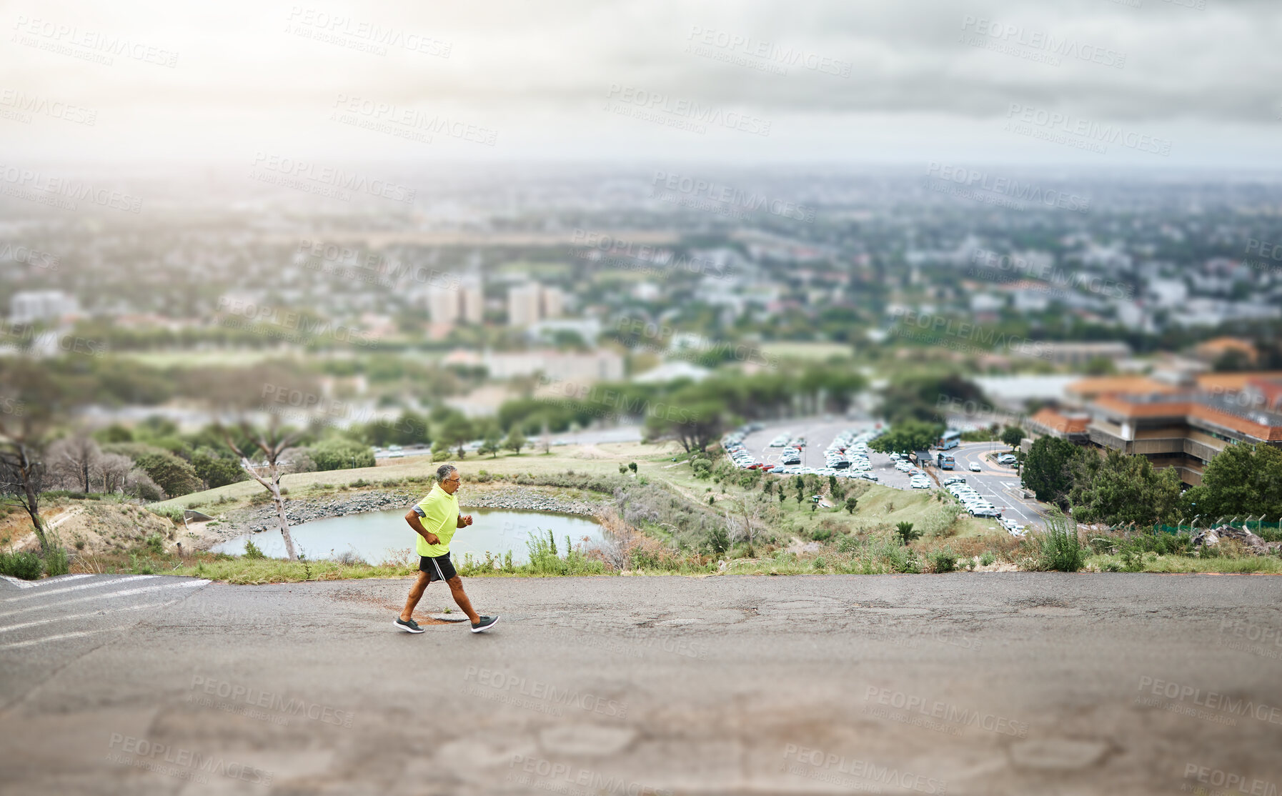 Buy stock photo Hiking, walking or man on road, nature or street for trekking journey or workout with urban path. Aerial, holiday vacation or top view of mature hiker outdoor for exercise, fitness or wellness 