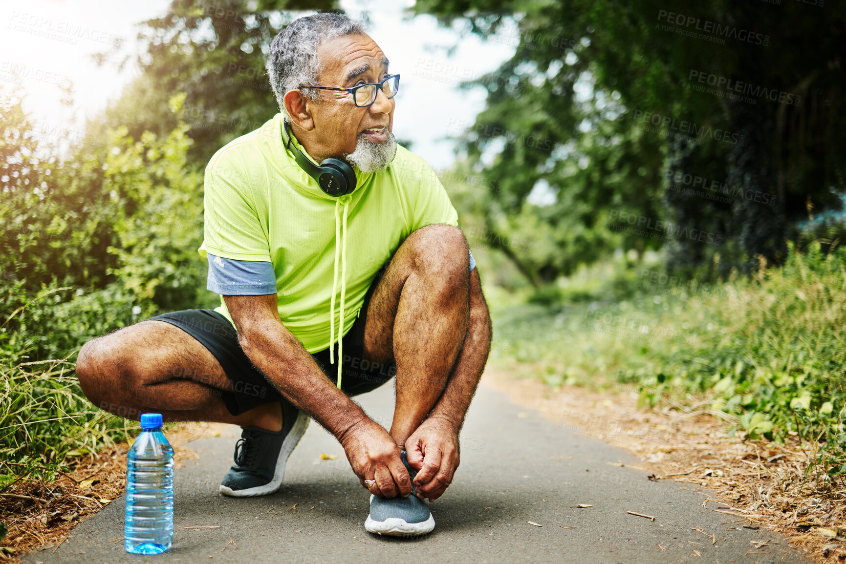 Buy stock photo Senior man, tie and shoes in fitness for running, workout or outdoor exercise on road, nature or asphalt. Mature male person and tying shoe getting ready or preparation for path, cardio or run