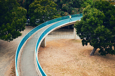 Buy stock photo Man, running and above bridge in nature, countryside or outdoor in environment with path in woods. Athlete, run or walking on road for cardio, fitness or exercise in forest with eco infrastructure