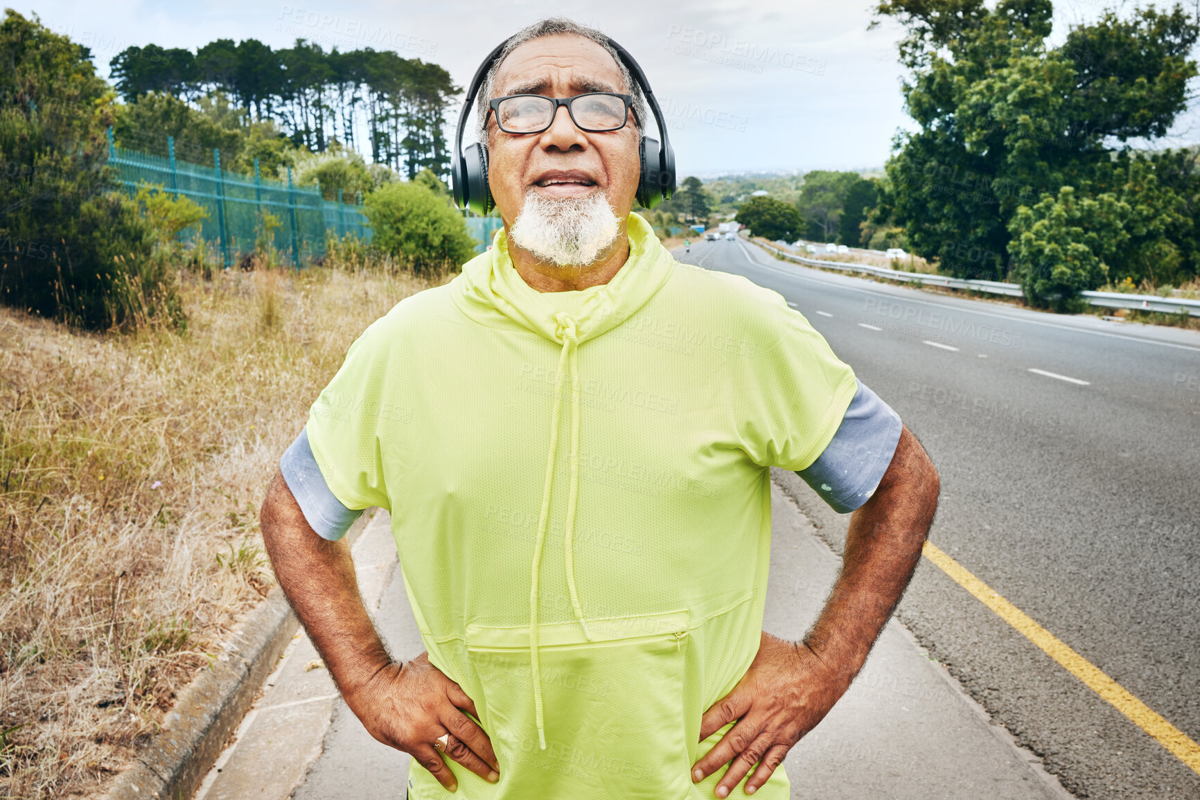 Buy stock photo Outdoor, tired and senior man with fitness, headphones and fatigue with exercise, workout and sweating. Elderly person, runner or old guy with a headset, exhausted or breathing for wellness or health