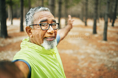 Buy stock photo Selfie, excited and senior man hiking for health, wellness or cardio training on a mountain. Smile, nature and happy elderly male person taking a picture on cellphone for outdoor trekking in woods.