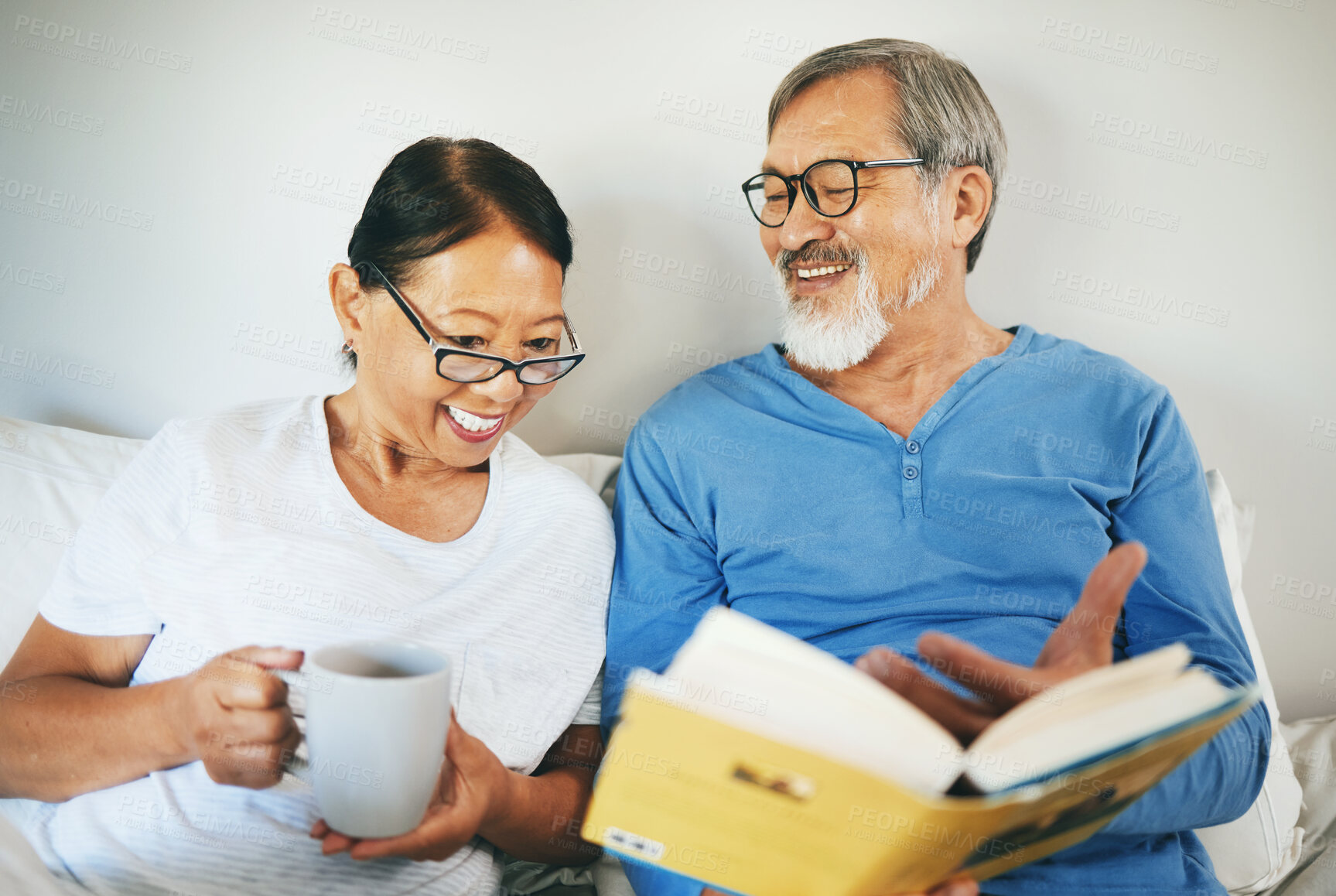 Buy stock photo Bible, senior or happy couple reading book in prayer, support or hope in home to worship together. Bed, Asian woman or mature man learning or studying God for grace in religion with love or coffee 