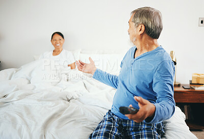 Buy stock photo Happy senior couple, watching tv and bed for weekend, retirement or relax together at home. Man and woman with remote for online streaming, entertainment or enjoying holiday honeymoon in bedroom