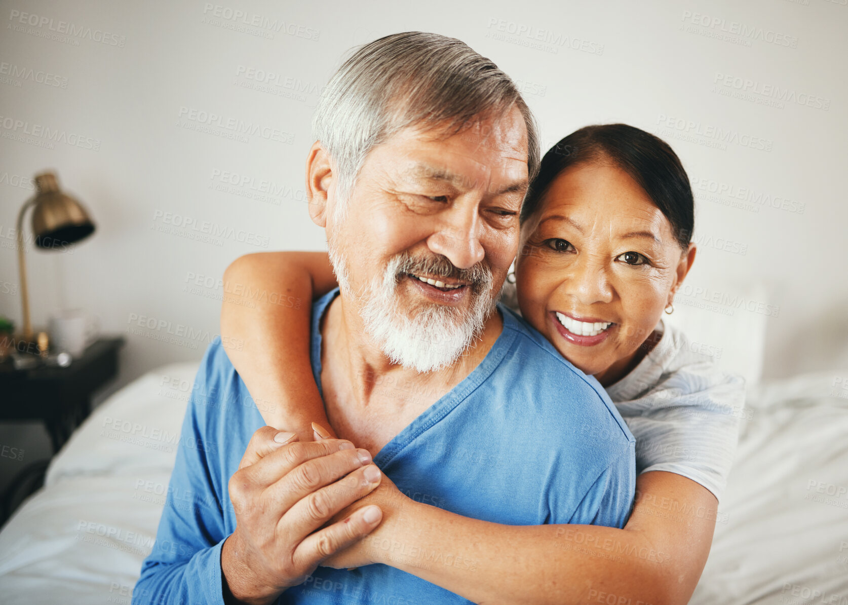 Buy stock photo Happy senior couple, hug and love in bedroom for marriage, relationship or care together at home. Mature woman hugging man with smile in happiness for embrace, support or trust on bed in retirement