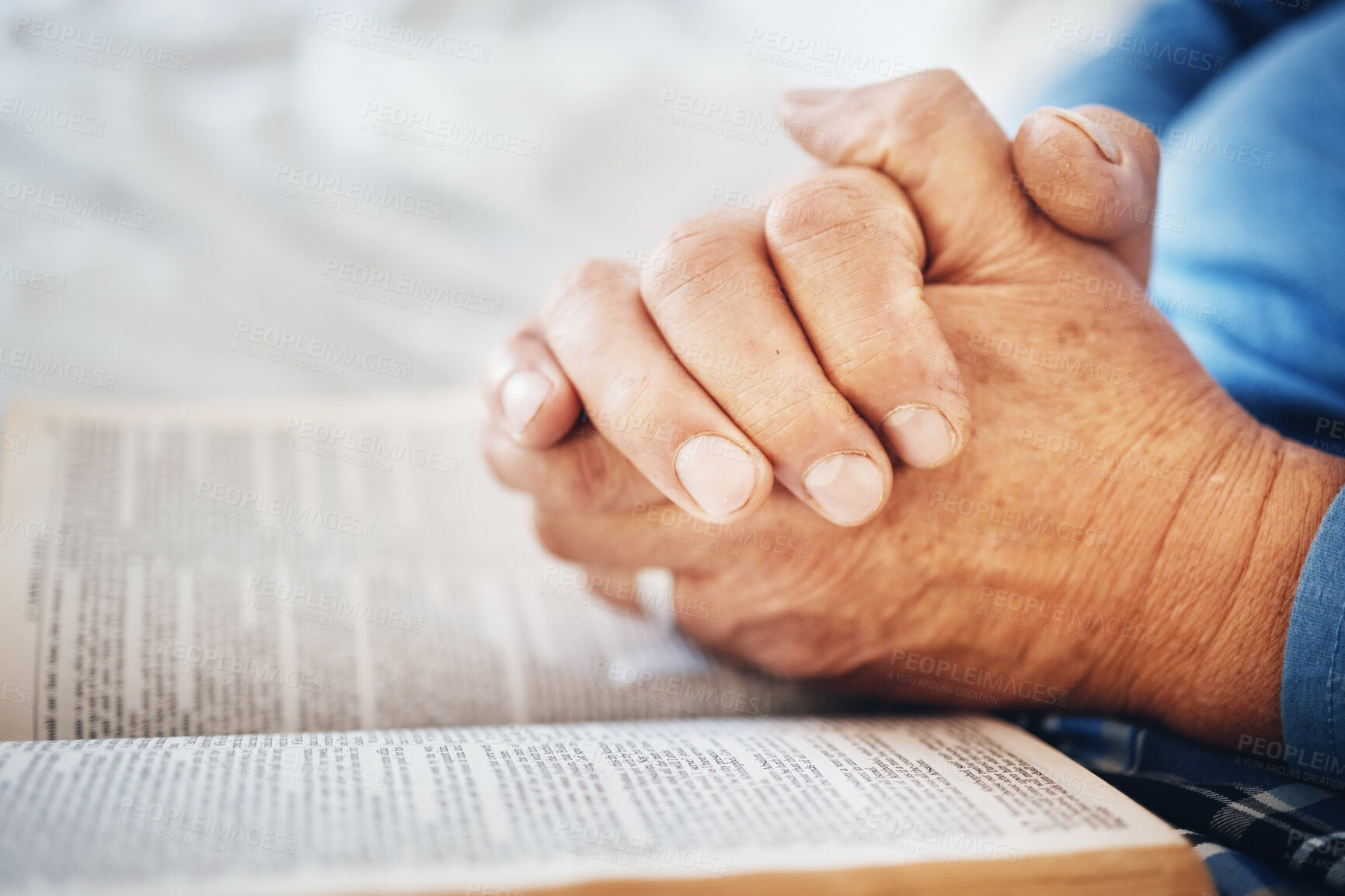 Buy stock photo Hands, Bible and pray with God and worship, religion with faith or spiritual, reading scripture for guide and hope. Gratitude, respect and Christian person with healing, wellness and religious book