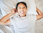 Bedroom face, music and relax happy woman sleeping, tired or nap for break, morning wellness or streaming audio podcast. Happiness, radio sound and top view person smile, rest and comfort on home bed