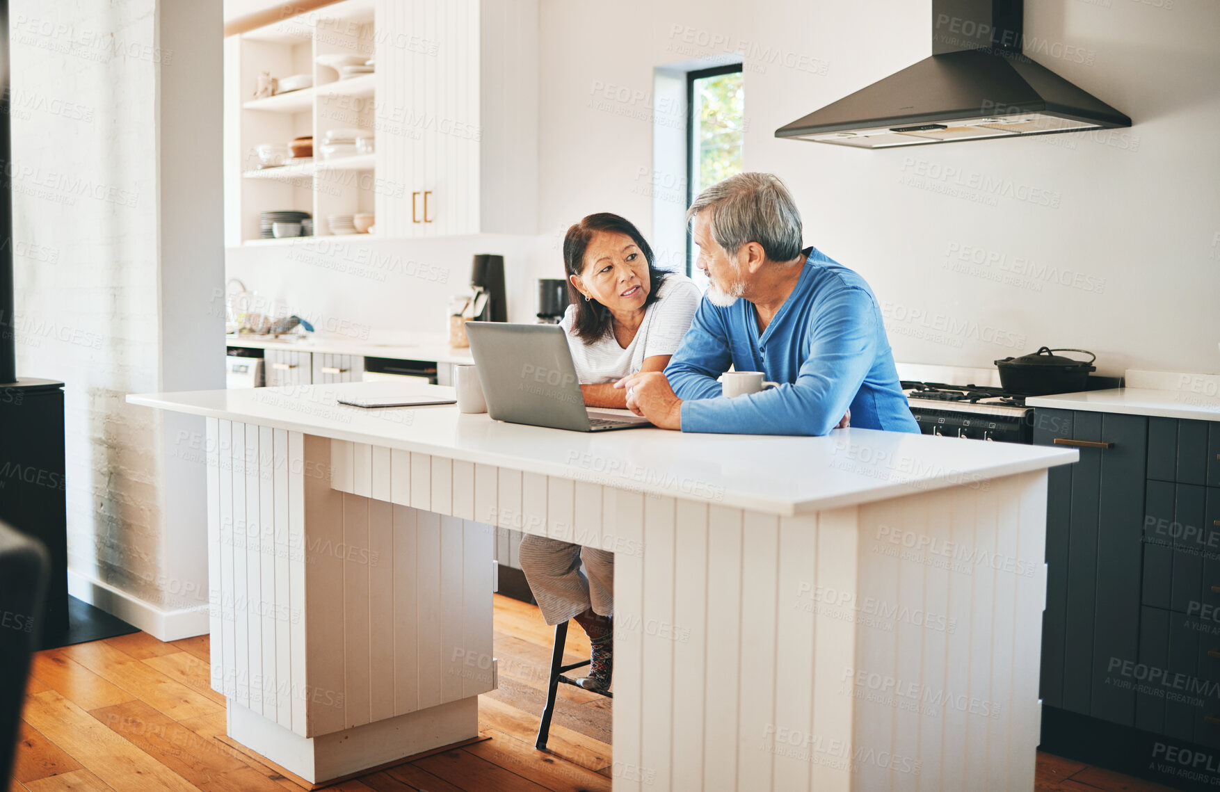 Buy stock photo Mature couple, laptop and kitchen for home ideas, asset management and planning of finance or mortgage at home. Woman and man talking of insurance, investment and budget, cost or debt on computer