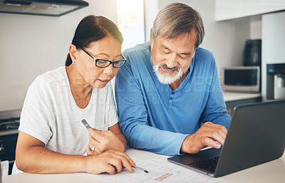 Buy stock photo Couple, computer and home documents for finance, loan payment and mortgage planning, bills and invoice in kitchen. Mature woman and man with asset management, life insurance and paperwork on laptop