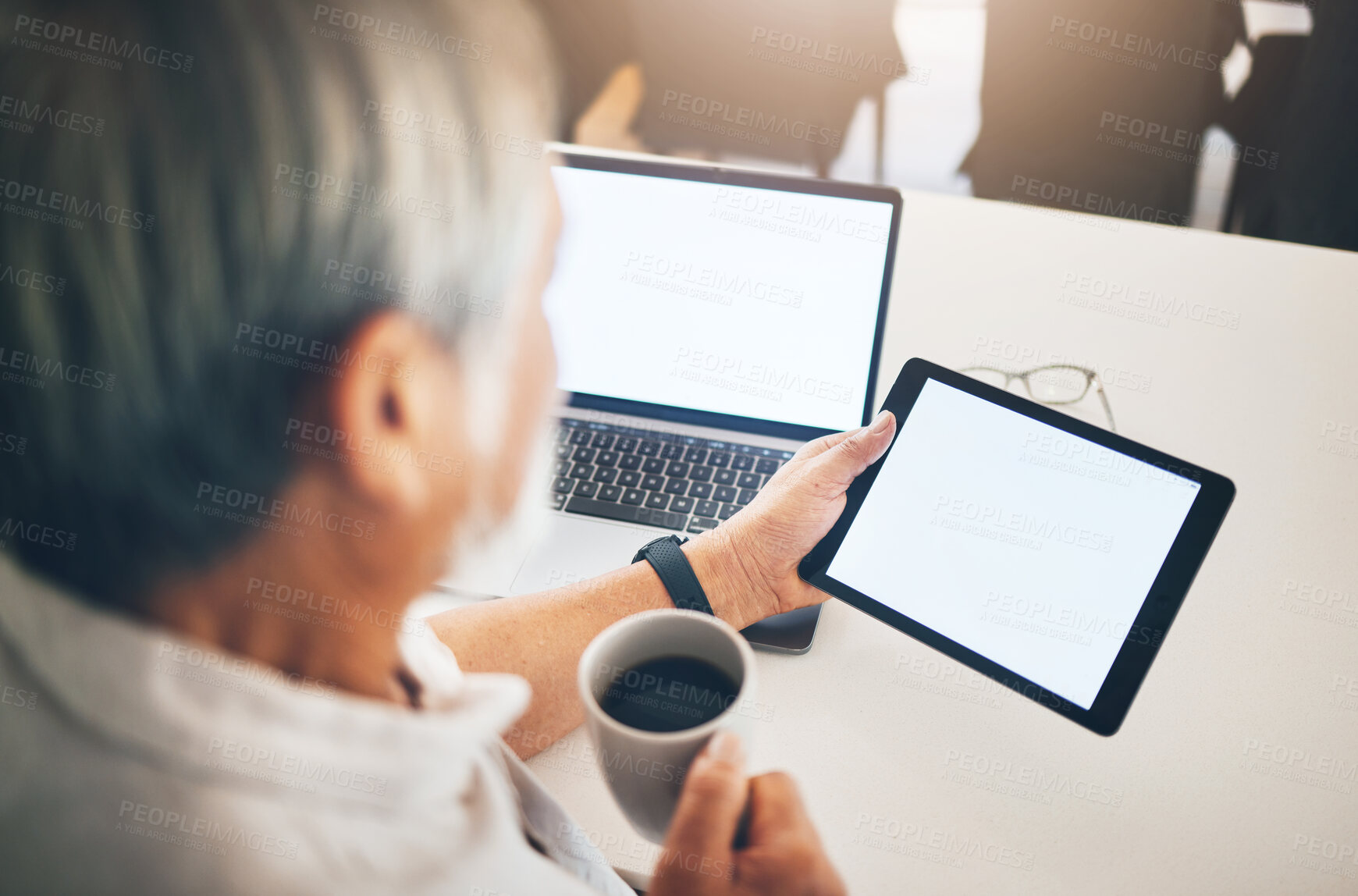 Buy stock photo Business man, tablet and laptop screen for trading, financial information or asset management with morning coffee at home. Trader reading on digital technology, mockup space and monitor stock market