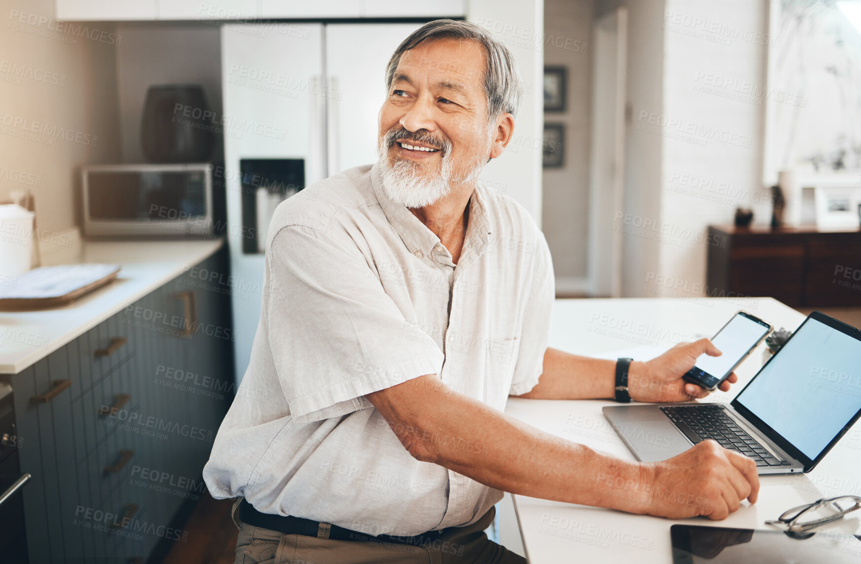 Buy stock photo Laptop, research and senior man in the kitchen networking on social media, website or the internet. Happy, technology and elderly Asian male person in retirement browsing on computer in modern home.