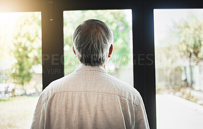 Buy stock photo Back, mature man and thinking by window, depression and anxiety alone in home. Rear view, retirement and sad person contemplating in house, planning future and remember memory, idea or reflection