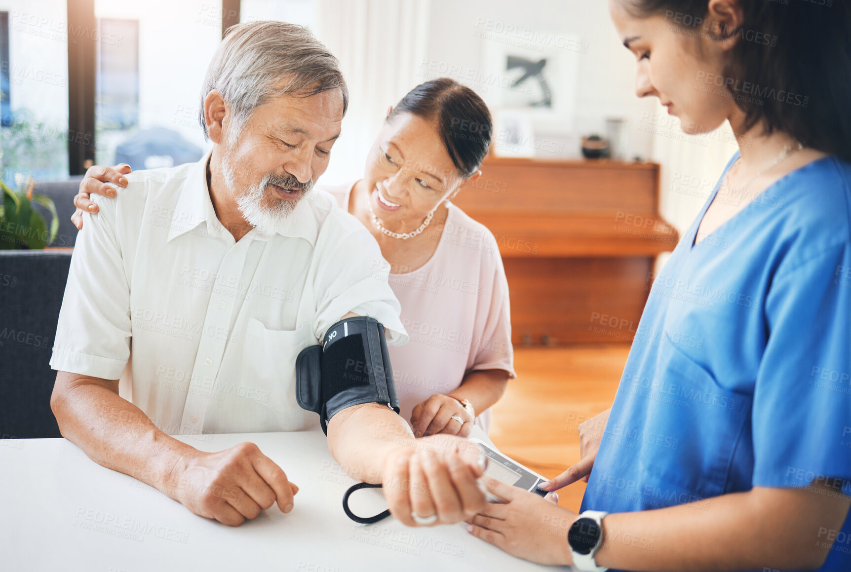 Buy stock photo Blood pressure, nurse and senior couple in living room with equipment for hypertension. Sick, doctor and caregiver with medical tool for male patient in retirement in lounge of home for consultation.