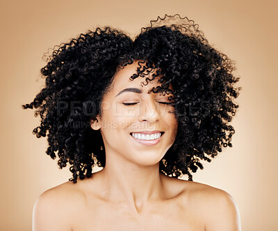 Buy stock photo Woman, curly or wind in afro hair for fun on studio background in healthy hairstyle growth, texture or frizz treatment success. African beauty model, shake or change by shampoo transformation results