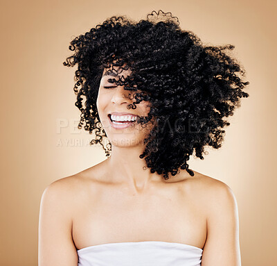 Buy stock photo Woman, curly or afro hair wind on fun studio background for healthy hairstyle growth, texture or frizz treatment. African beauty model, shake energy and happy change by shampoo transformation results