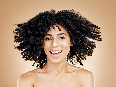 Buy stock photo Model, curly and hair wind in afro fun on studio background for healthy hairstyle growth, texture or frizz treatment. African beauty woman, portrait and shake change by shampoo transformation results