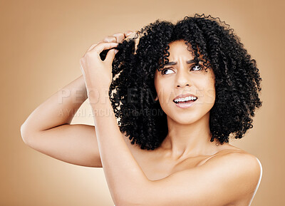 Buy stock photo Hair, frustrated and woman with afro knots, frizz and isolated in a studio brown background  with wellness and skincare. Comb, damage and confused person with cosmetic aesthetic in Brazil hairdresser