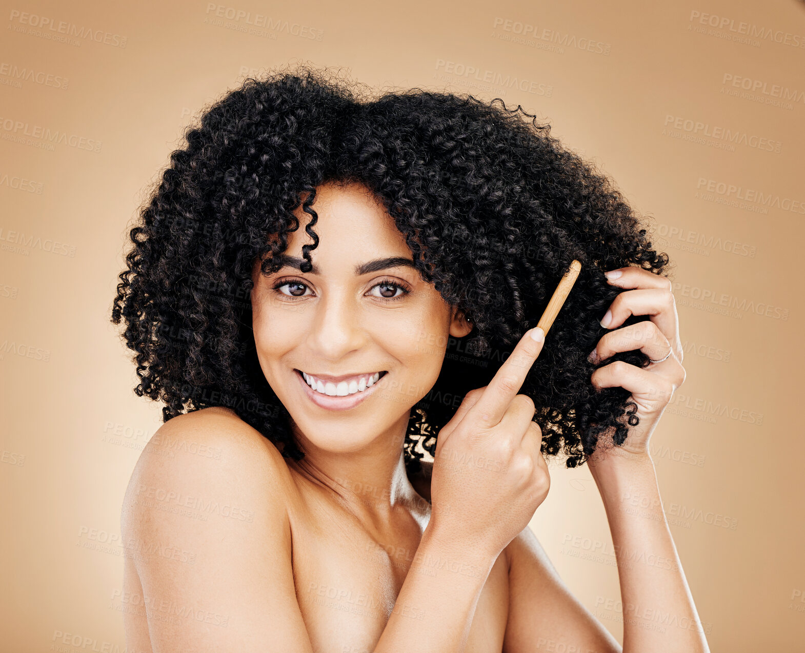 Buy stock photo Afro, hair and brush with portrait of woman in studio for beauty, natural growth or coil texture on brown background. Happy model, curly haircare or comb tools of healthy treatment, aesthetic or care