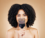 Hair, comb and portrait of woman with afro for style isolated in a studio brown background for wellness and skincare. Texture, natural and young person with cosmetic aesthetic in Brazil hairdresser