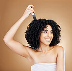 Hair, beauty and woman with afro comb for style isolated in a studio brown background for wellness and skincare. Brush, natural and young person with cosmetic aesthetic in Brazil hairdresser