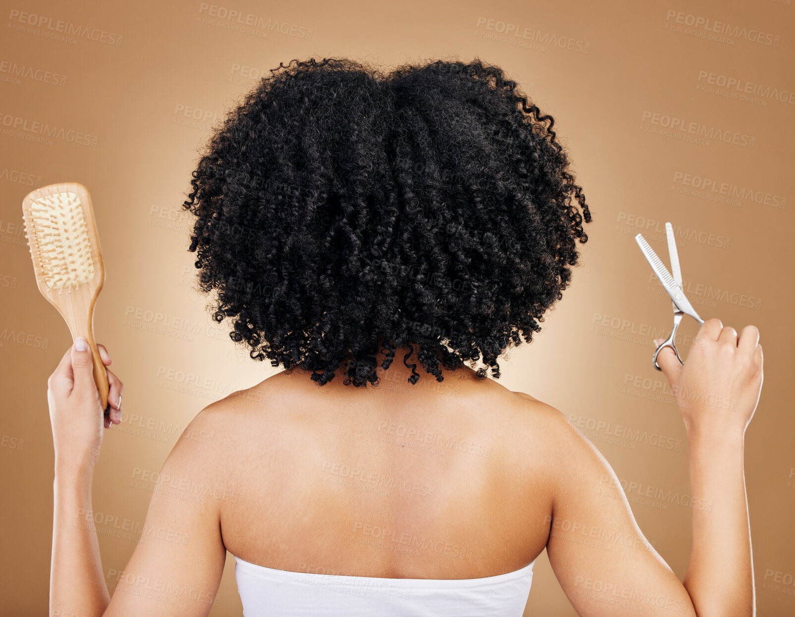 Buy stock photo Hair, scissors and brush, woman and back view for beauty and curls with natural cosmetics and shine on studio background. Texture, curly hairstyle with haircare and transformation, haircut and tools