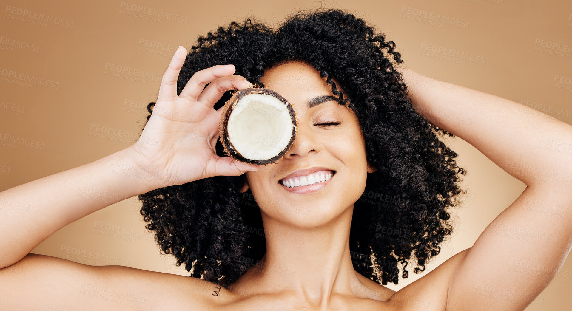 Buy stock photo Studio beauty, woman face and smile for coconut skin detox, wellness or facial makeup, organic cosmetics or self care. Eyes closed, fruit benefits and model with skincare product on brown background