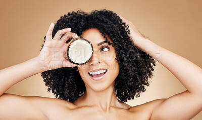 Buy stock photo Beauty studio face, happy woman and coconut for skin detox, natural wellness treatment or facial makeup. Happiness, fruit benefits and aesthetic person with food skincare product on brown background