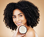 Woman, portrait and hair, coconut with shine and beauty, organic salon treatment for strong texture on studio background. Face, skin and natural cosmetic product for growth with haircare and fruit
