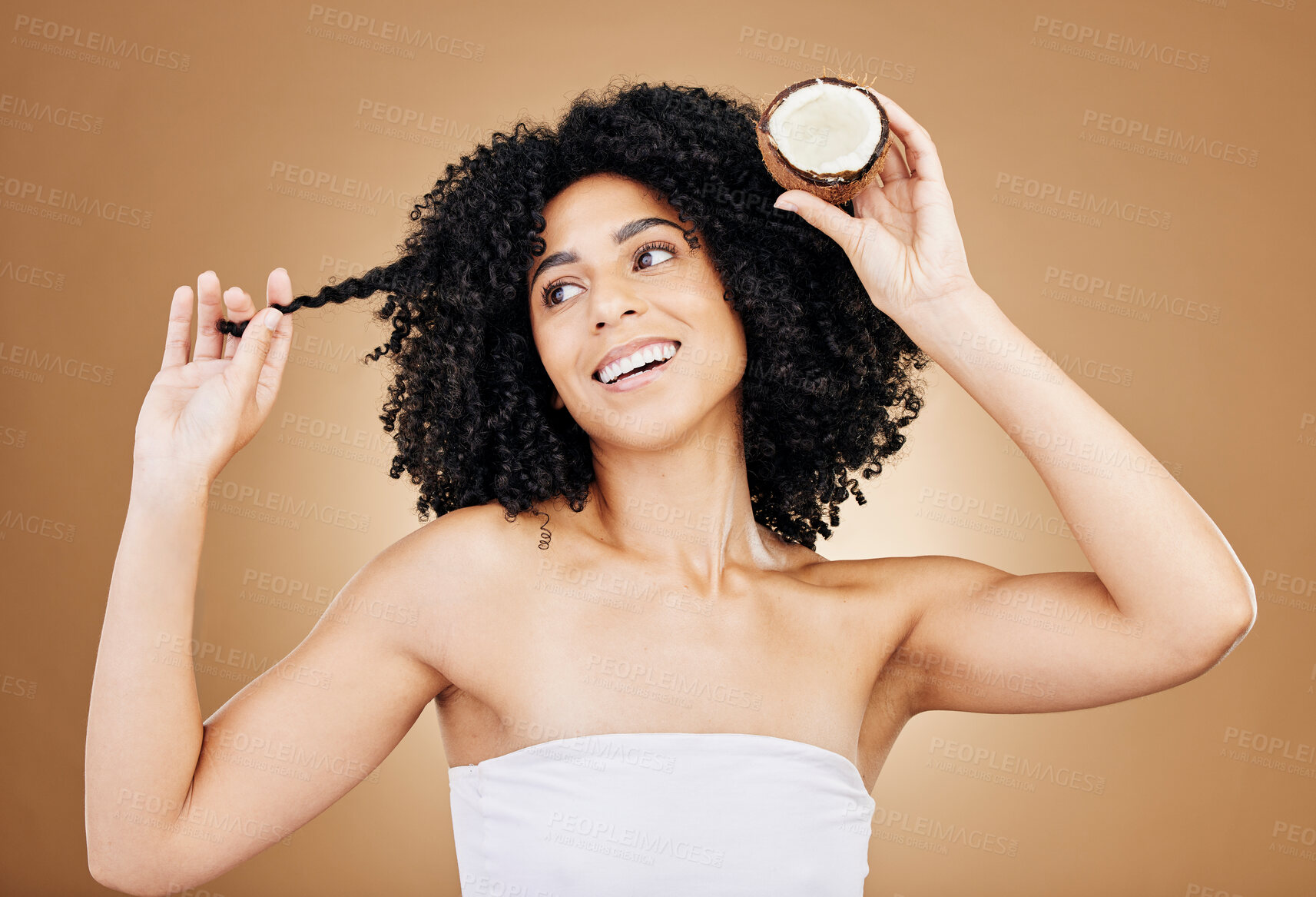 Buy stock photo Hair, growth and coconut with woman and beauty, natural cosmetics and skin isolated on studio background. Health, oil or cream product with fruit, eco friendly for texture and shine with haircare