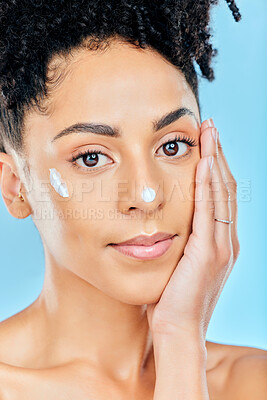 Buy stock photo Beauty skincare, portrait and woman with cream dermatology product for melasma, acne or sunscreen protection. Face makeup, studio cosmetics or person feel pimple prevention results on blue background