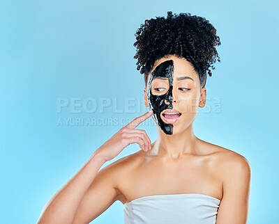 Buy stock photo Skincare, charcoal mask and face of woman for facial treatment, anti aging and wellness in studio. Beauty mockup, dermatology and person for healthy skin, cosmetics and grooming on blue background