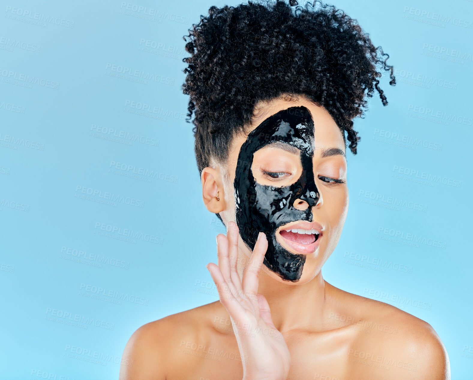 Buy stock photo Skincare, charcoal mask and woman in studio for facial treatment, anti aging detox and wellness. Beauty, salon and face of person with product for health, cosmetics or grooming on blue background