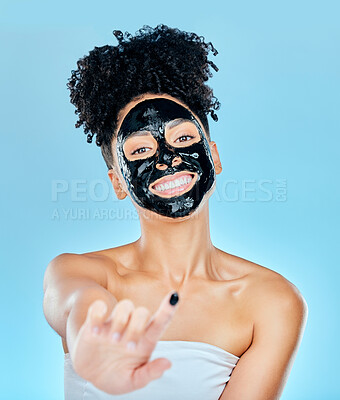 Buy stock photo Skincare, face mask and portrait of woman with finger for facial treatment, anti aging or wellness. Beauty, studio and happy person apply products for health, cosmetics or grooming on blue background