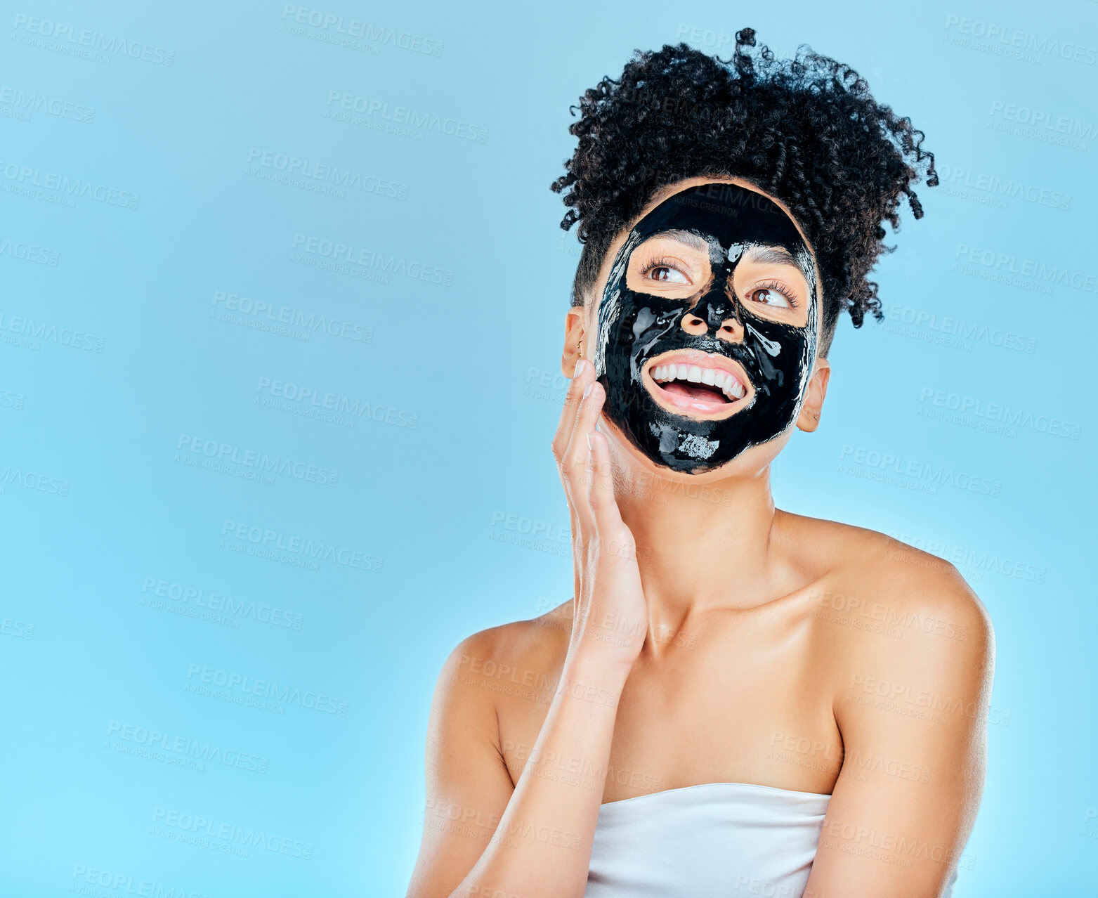 Buy stock photo Skincare, happy and woman with charcoal face mask for facial treatment, anti aging and wellness in studio. Beauty, dermatology and happy person for health, cosmetics or grooming on blue background