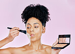 Makeup brush, palette and studio face of woman with tools, beauty routine and apply cosmetics powder, foundation or product. Mirror, facial transformation process and salon person on pink background