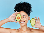 Avocado, skincare and beauty, woman with natural skincare and product for face on blue background. Health, wellness and facial mask, smile with green fruit and vegan for dermatology  in studio