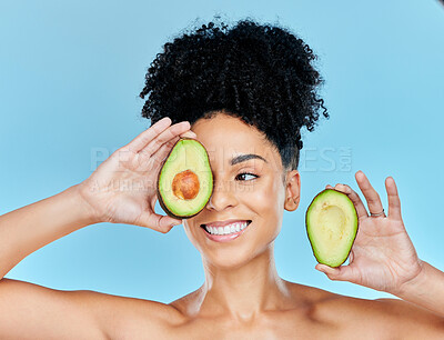 Buy stock photo Avocado, skincare and beauty, woman with natural benefits and product for face on blue background. Health, wellness and facial mask, smile with green fruit and vegan for dermatology in studio