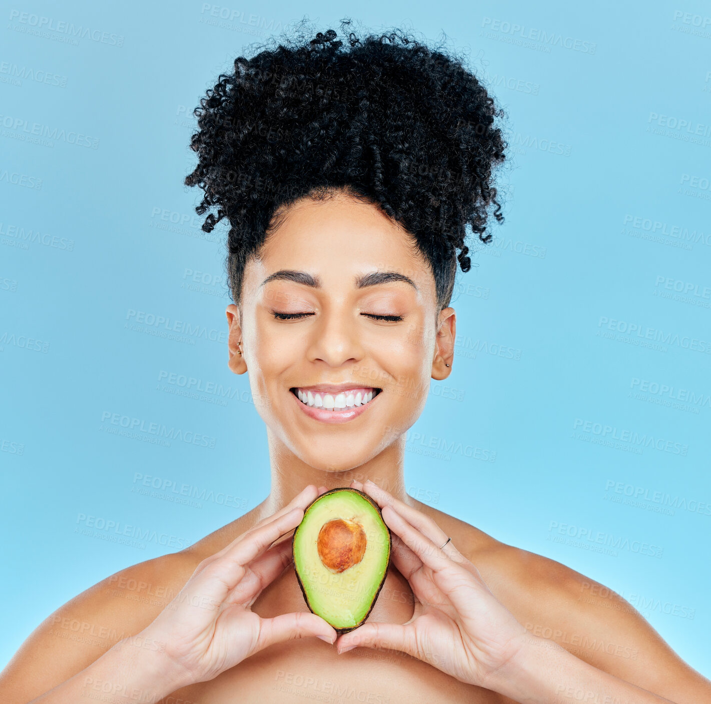 Buy stock photo Smile, skincare and happy woman with kiwi in studio for wellness, detox or natural cosmetics on blue background. Face, glow and female model with fruit for beauty, nutrition or dermatology care