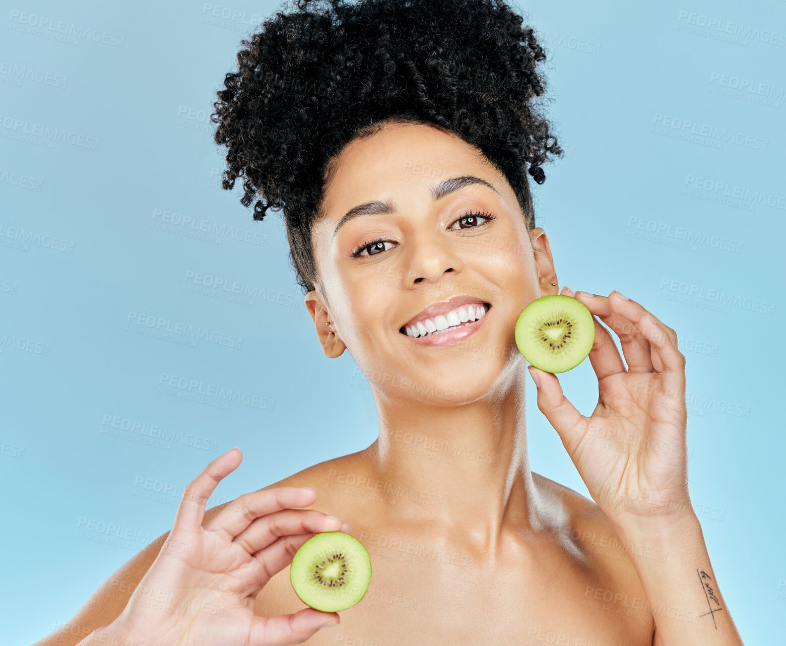 Buy stock photo Skincare, beauty and portrait of woman with kiwi in studio for glowing skin or wellness on blue background. Face, shine and female model with fruit for natural cosmetics, dermatology or treatment