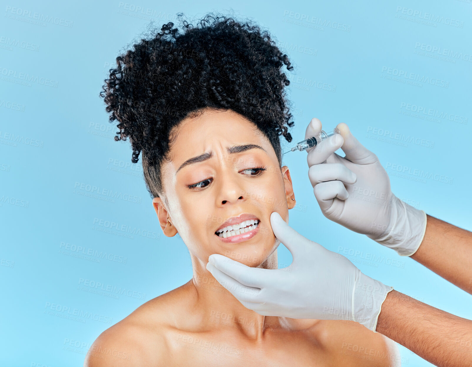 Buy stock photo Filler, fear and woman with hands on face in studio for collagen skincare injection or implant. Model with stress, anxiety and syringe for beauty, dermatology or cosmetic process on blue background.