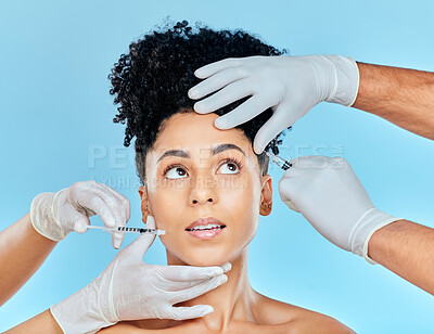 Skincare, needle and filler, woman with hands on face in studio at plastic surgery consultation. Model with stress, fear and anxiety for beauty, dermatology or collagen therapy on blue background
