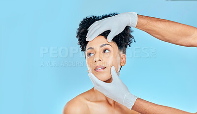 Buy stock photo Skincare, plastic surgery and woman with hands on face in studio at cosmetic consultation. Model with spa, facial and filler for beauty, dermatology or collagen therapy on blue background mockup.