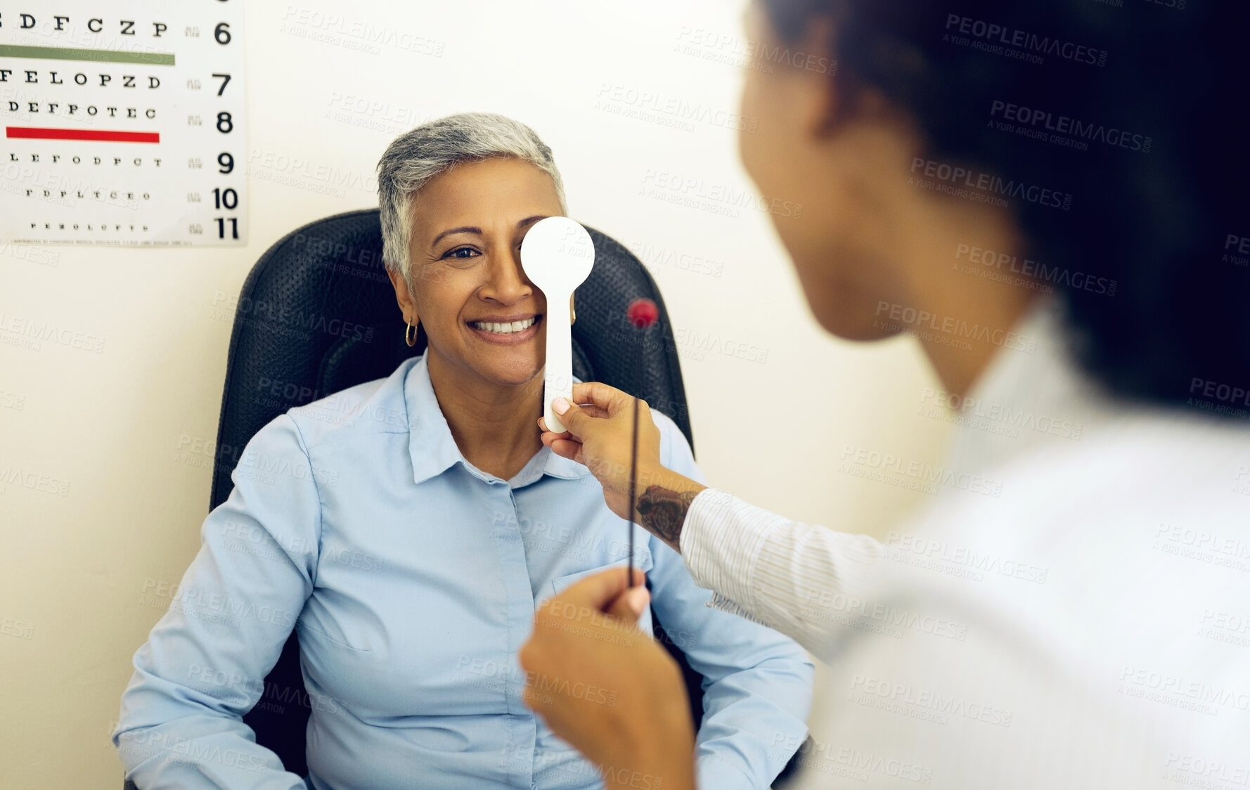 Buy stock photo Eye exam, woman and optometrist with cover for vision, healthcare and tool for focus or test at optometry. Eyes assessment, ophthalmology and person for medical support, glaucoma or retina testing
 
