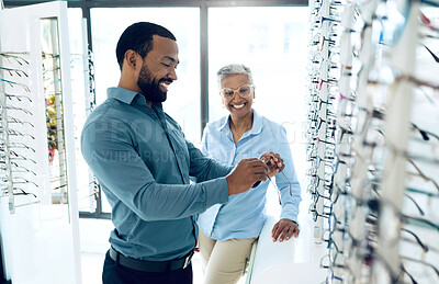 Buy stock photo Optometry, glasses and woman with patient for option, choice and eye care option in optician store. Healthcare, ophthalmology and people in clinic to choose prescription lens, spectacles and frames