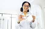 Optometry, woman is cleaning glasses with fabric and hygiene, vision and eye care with health and wellness. Eyewear, maintenance and wipe away dust with microfiber cloth at clinic and frame with lens