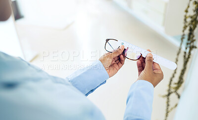 Buy stock photo Hands, measuring lens and frame of glasses, person in optometry clinic with eye care, test and healthcare. Eyewear, wellness and prescription with health, spectacles and optometrist with ruler tools