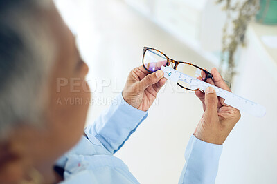 Buy stock photo Eye care, hands measuring lens and frame of glasses, person in optometry clinic, test and healthcare. Eyewear, wellness and prescription with health, spectacles and optometrist with ruler tools